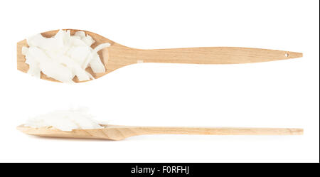 Wooden spoon full of coconut's chips Stock Photo