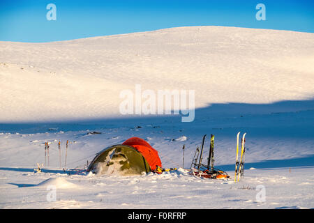 Ski-tourers  tents in the Dovre National Park, Norway Stock Photo