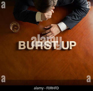Phrase Burst Up and devastated man composition Stock Photo - Alamy