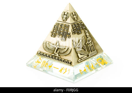 Brass Pyramid souvenir isolated on white Stock Photo