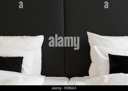 Detail of pillows on a modern double bed Stock Photo