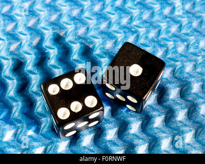 Lucky Seven Rolled Dice on Blue Textured Background Stock Photo