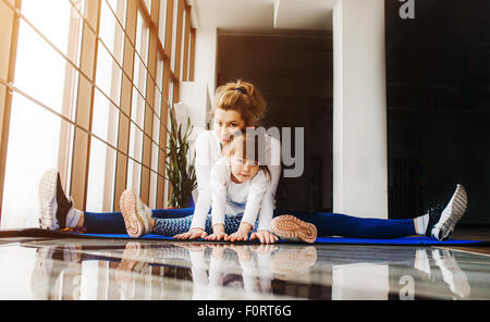 Charming family spends time in the gym Stock Photo