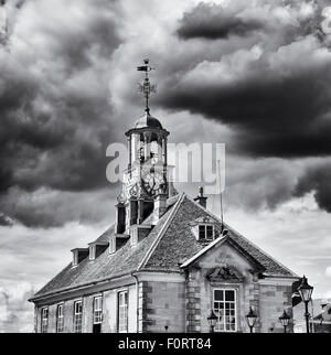 Brackley town hall with clock tower against stormy clouds. Northamptonshire. England. Black and White Stock Photo