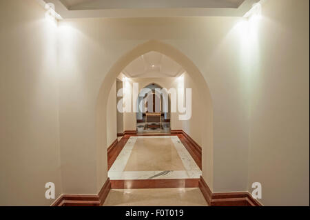 Interior architectural design of a corridor in large villa with series of arches Stock Photo