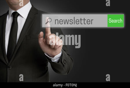 Newsletter internet browser is operated by businessman. Stock Photo