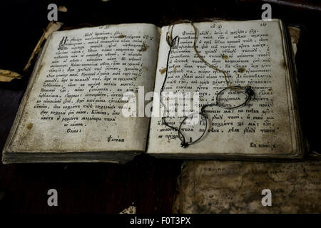 old book and glasses lying on its pages Stock Photo