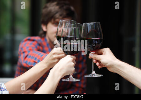 friends toasting with wine Stock Photo
