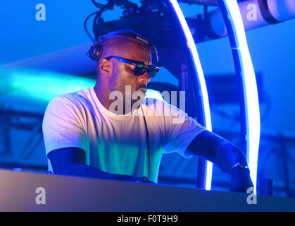 Idris Elba smokes a hand-rolled cigarette while playing a DJ set at the Goodwood Racecourse in West Sussex, at the last of their 'Three Friday Nights' events  Featuring: Idris Elba Where: Chichester, West Sussex, United Kingdom When: 19 Jun 2015 Stock Photo