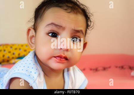 Portrait of a cute little Bengali boy in different moods with closeup, copy space Stock Photo