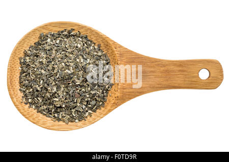 dried wakame seaweed - top view of a wooden spoon isolated on white Stock Photo