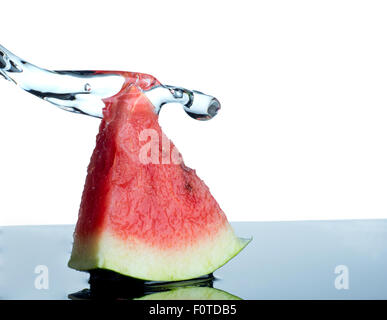 watermelon and water splash isolated on white Stock Photo