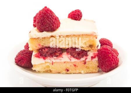 Cheesecake with raspberries isolated on white. Stock Photo