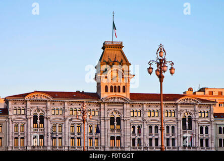 Trieste, Italy - Unity of Italy Square, City Hall at sunset with tower, clock and quarter bell Stock Photo