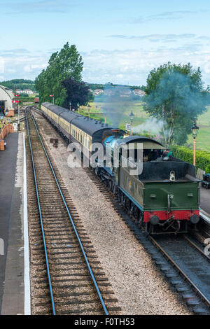 Restored steam locomotive on the West Somerset Railway, stopped at Williton Station, West of England Stock Photo