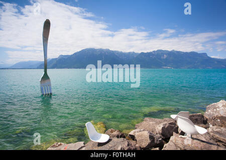 Vevey, Switzerland - July 8,2015: Giant steel fork in water of Geneva lake, Vevey, Switzerland.The fork went up in 1995 to mark Stock Photo