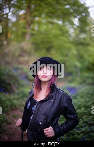 Portrait of strong woman in leather jacket, leggings, sunglasses and silk  bandana Stock Photo - Alamy