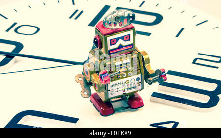 robot on a clock concept Stock Photo