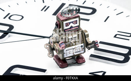 robot on a clock concept Stock Photo