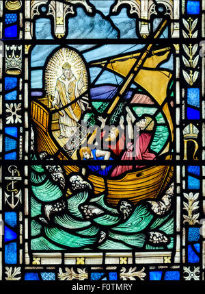 Stained glass window depicting Jesus calming the storm, St. Andrew's Church, Dent, Yorkshire Dales National Park, Cumbria, UK Stock Photo