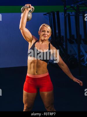 Young woman training weightlifting Stock Photo - Alamy