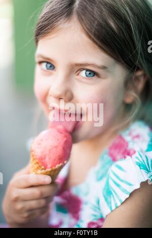 Portrait of young girl eating icecream
