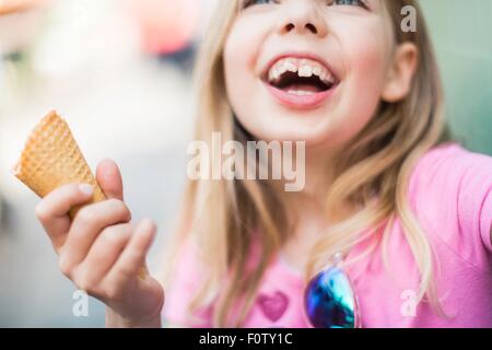 Portrait of young girl eating icecream Stock Photo