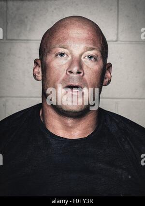 Portrait of bald young man with open mouth after workout Stock Photo