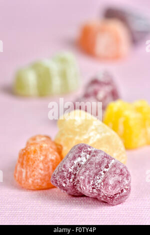 Jelly babies on pink background Stock Photo