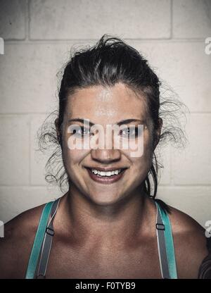 Portrait of confident sweaty young woman after workout Stock Photo