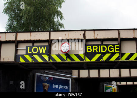 Low Bridge with chevrons and height limit, Solihull, UK Stock Photo