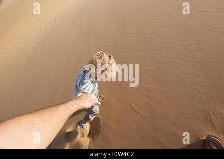 Boy walking on sand, Dune 7, Namib-Naukluft National Park, Africa Stock Photo