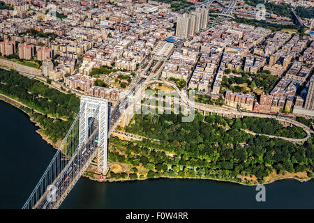 George Washington Bridge Upper Manhattan - Aerial view of the New York City NYC side of the George Washington Bridge commonly referred to as the GW, GWB or the Big Gray Bridge. Also seen is the Jeffrey Hook Lighthouse next to the bridge stanchion and the Upper Manhattan neighborhood of New York City.  Available in color as well as in a black and white print.  To view additional images from my New York City gallery please visit: www.susancandelario.com Stock Photo