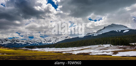 Thick Clouds over snow covered mountain peaks Colorado Rocky Mountains Landscape