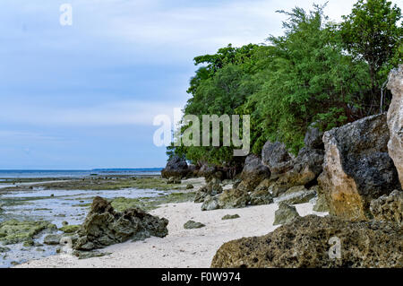 Rock Formations in the Sea. When waters recede outwards, rock formations are visible for everyone to behold Stock Photo