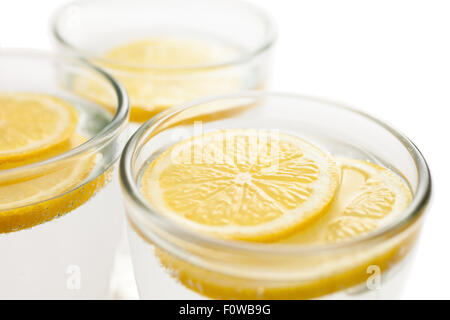 A Glass of Cold Water with Ice and Lemon on a Blue Background Stock Photo -  Image of isolated, object: 148203114