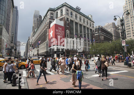 The always busy intersection of 34th St. & Broadway at Macy's Dept. Store. NYC. Stock Photo