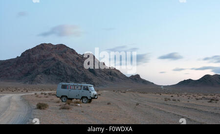 On the (dirt) road, near Khovd at sunrise, Western Mongolia Stock Photo