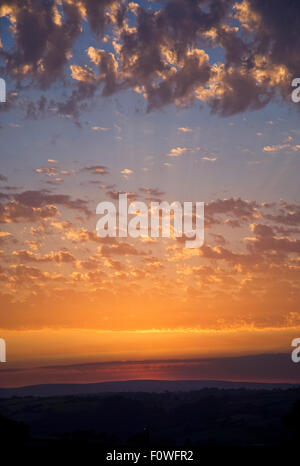 Spectacular sunset,  Golden sky, interesting cloud formations. Stock Photo