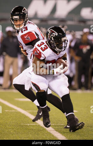 Atlanta Falcons running back T. J. Duckett (45) pushes past the Tampa Bay  Buccaneers defense including linebacker Shelton Quarles (53) for the first  of two first half touchdowns at the Georgia Dome