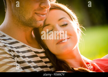 Intimate moments - young couple embracing and hugging in nature Stock Photo