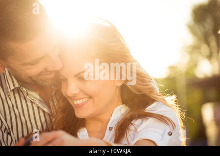 https://l450v.alamy.com/450v/f0wkja/happy-couple-having-great-time-together-photographed-at-sunset-against-f0wkja.jpg
