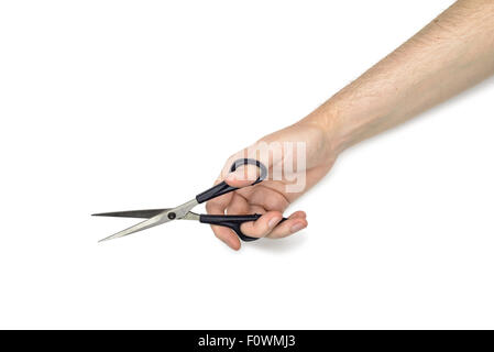 A woman is holding metallic scissors with black handles, isolated on white background Stock Photo