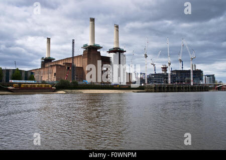 Battersea Power Station redevelopment and adjoining new residential project under construction, seen from River Thames, London Stock Photo