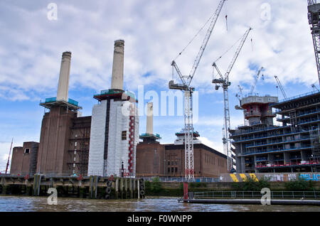 Battersea Power Station redevelopment and adjoining new residential project under construction, seen from River Thames, London Stock Photo