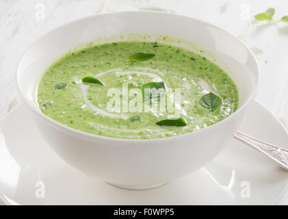 Creamy vegetable soup in a white bowl. Selective focus Stock Photo