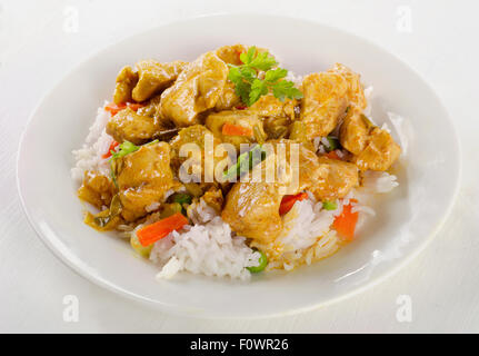 Chicken Curry and rice on a white plate. Selective focus Stock Photo