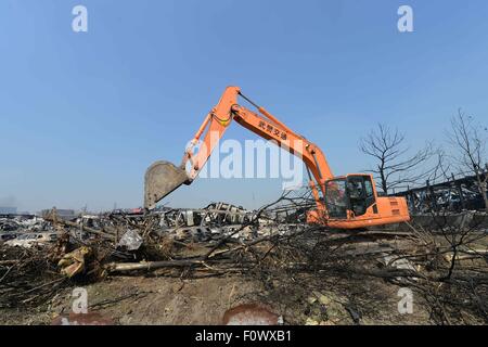 Tianjin, China. 22nd Aug, 2015. Rescuers clean up the debris at the core blast site in Tianjin, north China, Aug. 22, 2015. The death toll from a warehouse blast in Tianjin has risen to 121, including 67 firefighters and seven policemen, authorities said at a press conference on Saturday. Credit:  Yin Dongxun/Xinhua/Alamy Live News Stock Photo