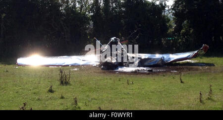 Sandown, Isle of Wight, UK. 22nd August, 2015. A LIGHT aircraft has crashed at an event marking the Second World War at the Isle of Wight Airport today.   A spokesman for the Isle of Wight Fire and Rescue Service said the single-engined plane crashed at the airport in Lake, before bursting into flames.  No one was trapped in the plane, though it is not known if anyone was injured. It was believed the pilot pulled themselves free following the crash. Credit:  jason kay/Alamy Live News Stock Photo