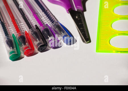 colored pens, scissors and ruler closeup on light bacground Stock Photo